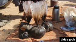 Opium is traded at a market in Helmand Province. (file photo)