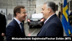 Hungarian Prime Minister Viktor Orban (right) welcomes Swedish Prime Minister Ulf Kristersson in Budapest on February 23.