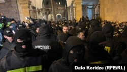 Georgian police face off with protesters outside parliament on March 2.