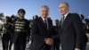 Uzbek President Shavkat Mirziyoev (left) and Russian leader Vladimir Putin at Tashkent airport on May 26. 