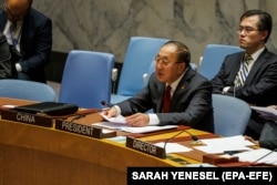 Zhang Jun, China's ambassador to the UN, speaks at the Security Council in New York on November 15 about a resolution calling for more humanitarian corridors to be set up in the Gaza Strip.