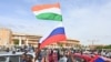 Supporters of Niger's National Council for the Safeguard of the Homeland wave Nigerien and Russian flags as they demonstrate in Niamey on August 6.