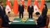 Georgian Prime Minister Irakli Garibashvili (left) inking a strategic partnership agreement in China in late July