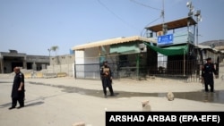 Pakistani security officials stand guard at the border on September 7 following clashes between security forces of Pakistan and Afghanistan near the Torkham crossing.