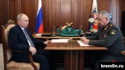 Russian President Vladimir Putin (left) attends a meeting with Defense Minister Sergei Shoigu in Moscow on April 17.