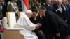 Hungarian Prime Minister Viktor Orban (right) greets Pope Francis sitting beside Hungarian President Katalin Novak at a reception held in Buda Castle on April 28.