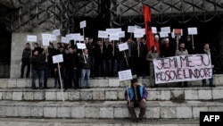 Ethnic Albanians take part in a protest in Pristina on January 16