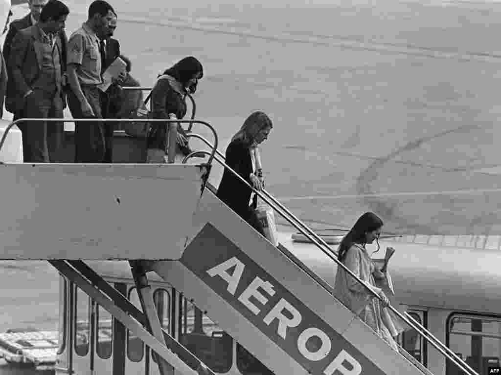 Former hostages, released by their captors, arrive at France&#39;s Orly airport on November 20, 1979. 