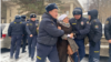 Kyrgyz police detain a protester in Bishkek's Gorky Park on January 10. 