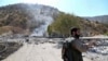 A Kurdish peshmerga fighter inspects the damage following an Iranian cross-border attack in the area of Zargwez, where several exiled left-wing Iranian Kurdish parties maintain offices, around 15 kilometers from the Iraqi city of Sulaymaniyah, in September 2022.