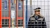 A Romanian border guard stands on duty at a railway border-crossing point at the EU's external border with Moldova. (file photo)