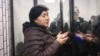 Klara Sooronkulova speaks to journalists while detained at a court in Bishkek on December 13.