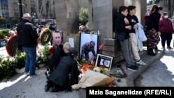 People gather at a memorial dedicated to the events of April 9, 1989, in Tbilisi.