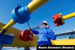 An employee checks a gas valve at the Atamanskaya compressor station, part of Gazprom's Power of Siberia gas pipeline, outside the Far Eastern town of Svobodny in the Amur region.