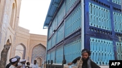 Sufis pray at the Khaja Abdullah Ansari shrine in the western Afghan city of Herat.