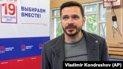 Ilya Yashin speaks with the Associated Press at a polling station during parliamentary elections in Moscow in September 2021.