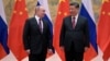 Russian President Vladimir Putin (left) attends a meeting with Chinese President Xi Jinping in Beijing on February 4.