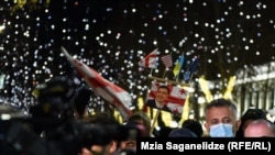 Saakashvili supporters rally near the parliament. building in Tbilisi on December 21.