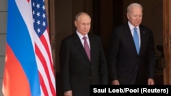 U.S. President Joe Biden (right) and Russian President Vladimir Putin arrive for a summit in Switzerland in June. (file photo)