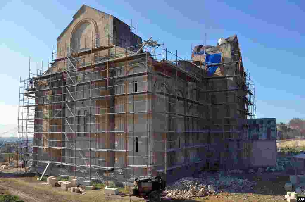 The monument is currently cloaked in scaffolding as controversial restoration work is carried out.