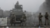 Troops are seen in Almaty's main square where hundreds of people were protesting against the government after the Kazakh authorities' decision to lift price caps on liquefied petroleum gas.