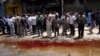 Dozens Killed In Iraq Bombings