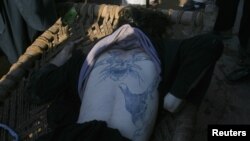 A Taliban militant who was killed during a gun battle in Peshawar was found to have an elaborate tattoo on his back.