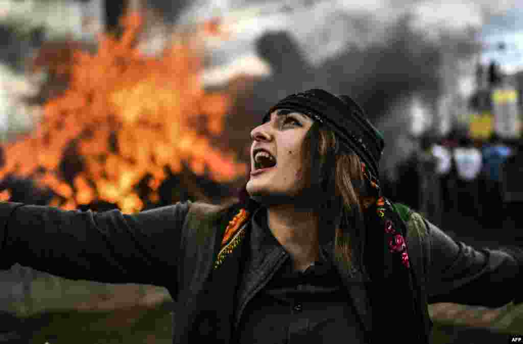 A Kurdish woman dances around a bonfire in the Turkish town of Diyarbakir on March 21.