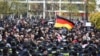 Hundreds of Saakashvili supporters on November 10 rallied outside government buildings and in front of the courtroom where his trial started without the presence of the accused.