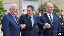 Palestinian President Abbas, French President Sarkozy, and Isreali Prime Minister Olmert (left to right) at Elysee Palace on July 13