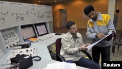 Workers at a nuclear power plant unit in Bushehr, Iran. Many in the West suspect Tehran's atomic programme is aimed at producing nuclear weapons.