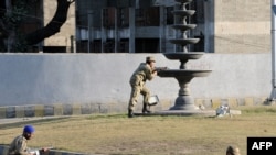 Soldiers take up position outside a besieged mosque in Rawalpindi.