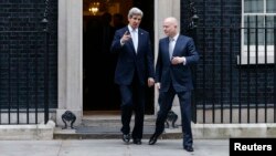 U.S. Secretary of State John Kerry (left) and Britain's Foreign Secretary William Hague leave No. 10 Downing Street in London on February 25.