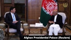 Afghan President Ashraf Ghani (right) meets with U.S. Defense Secretary Mark Esper in Kabul on October 20.