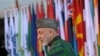 Afghan President Hamid Karzai arrives at the start of the Afghanistan conference in Bonn on December 5.