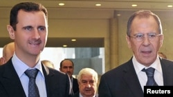 Syrian President Bashar al-Assad (left) and Russian Foreign Minister Sergei Lavrov in Damascus on February 7