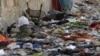 Backpacks and belongings of Afghan people who were waiting to be evacuated are seen at the site of the August 26, 2021, twin suicide bombings, which killed scores of people, including 13 U.S. troops, at Kabul airport.