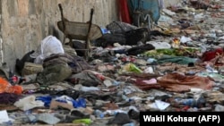 Backpacks and belongings of Afghan people who were waiting to be evacuated are seen at the site of the August 26, 2021, twin suicide bombings, which killed scores of people, including 13 U.S. troops, at Kabul airport.