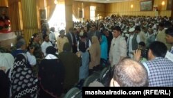 Afghan President Ashraf Ghani meets people during a visit on July 1 to the eastern city of Jalalabad. 