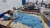 Injured victims of a rainstorm are treated at a hospital in Bannu, a town in Pakistan's Khyber Pakhtunkhwa Province, on June 10. 