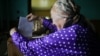 A voter in Slabada, outside the capital, Minsk, casts her ballot on September 11.