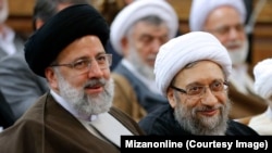 Current judiciary chief Ebrahim Raisi (left) with Sadegh Amoli Larijani earlier this year.