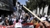 Demonstrators shout slogans near the Greek parliament building during a protest in Athens on May 4.