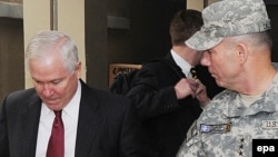 U.S. Secretary of Defense Robert Gates (left) with U.S. Army Lieutenant William Caldwell IV, commander of NATO Training Mission Afghanistan, at Camp Eggers in Kabul on December 9