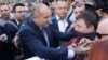 Bulgarian President Rumen Radev (left) came out and thanked protesters for their support. 