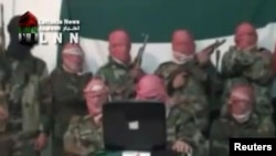 Alleged army defectors say they will try to protect civilians and attack Syrian security forces in this still image taken from amateur video footage shot near Damascus on November 16.