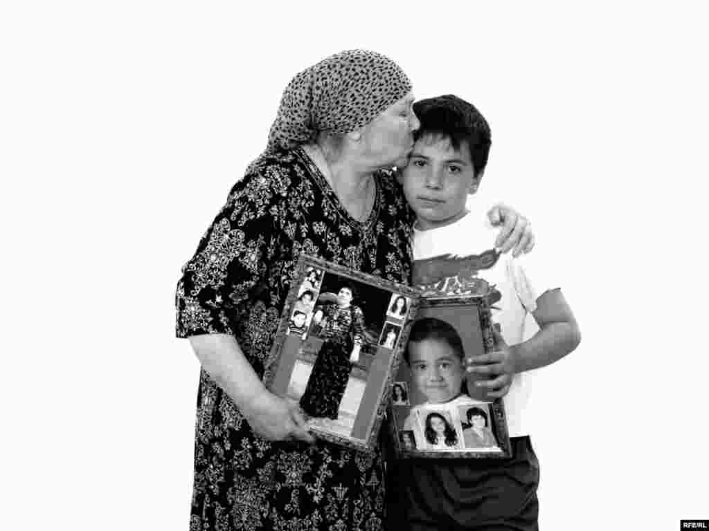 Tamara Shotayeva and her grandson, Georgy Kuchuyev - Tamara lost her daughter Albina and her granddaughter Zarina, who was starting second grade. Tamara's husband, Tsara, couldn't cope with the loss and died soon after of heart failure. During the siege, Tamara was visiting her sick mother in Siberia. Her friends thought she wouldn't be able to bear the news. She suffered from asthma and had already undergone three complicated operations. But it was Tamara who identified the body of her daughter, and who has since become the source of support for the men in her family who survived the tragedy.