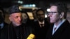 Afghan President Hamid Karzai (left) and German Foreign Minister Guido Westerwelle speak to reporters upon Karzai's arrival in Germany for the Bonn II conference on December 5.