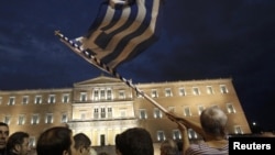 Protests flared November 7 outside the Greek parliament in Athens.