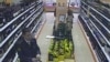 A TV grab shows former police officer Denis Yevsyukov reloading his pistol in a Moscow supermarket on April 27, 2009. 